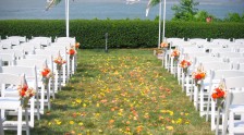 The lawn set for a wedding with flower petals